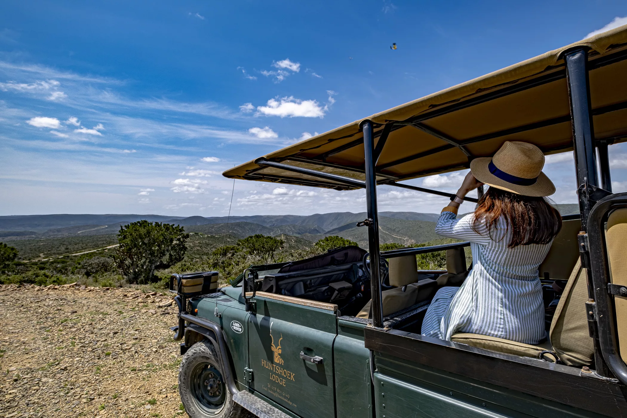 Guest enjoying a game drive at Huntshoek Lodge overlooking the Eastern Cape landscape